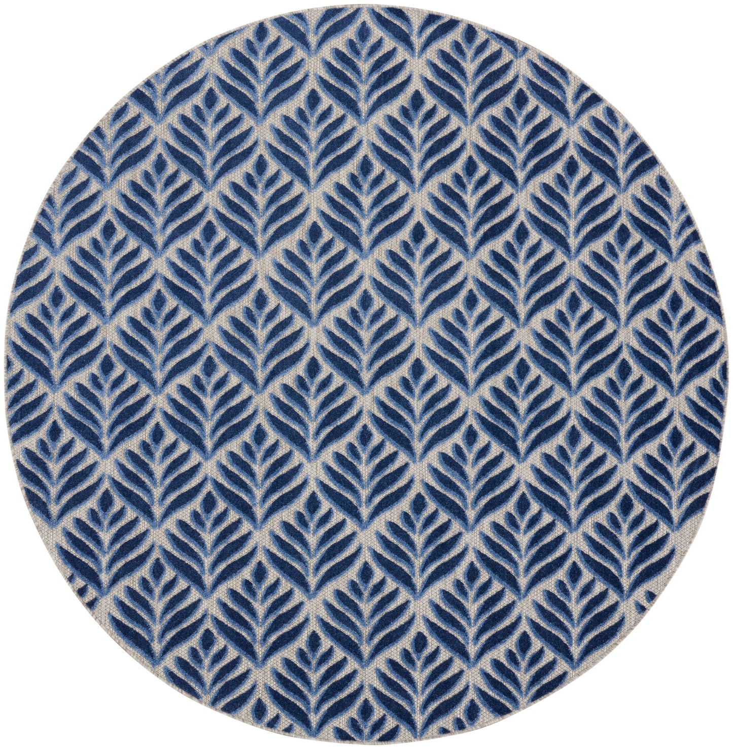 Round rug with navy blue leafy trellis pattern on a beige background.