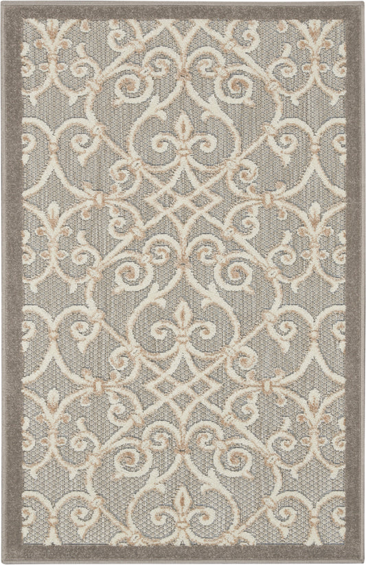 Gray area rug with cream-beige scrolling lattice pattern and taupe border; contemporary style for living rooms.