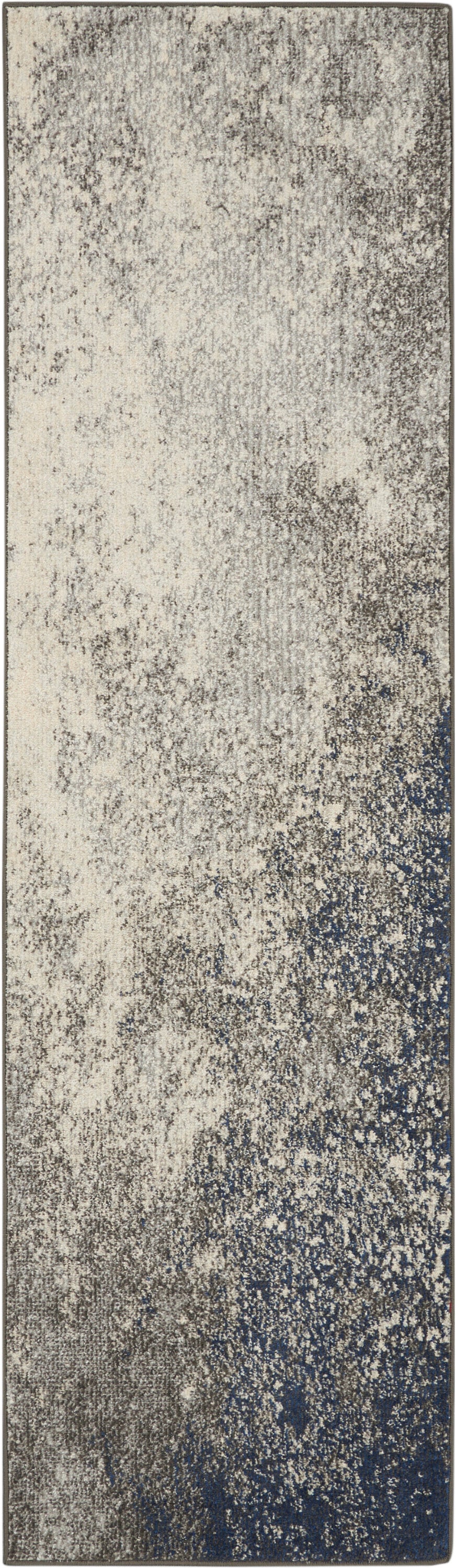 Rectangular runner rug with cream-gray speckled gradient fading to deep navy at bottom