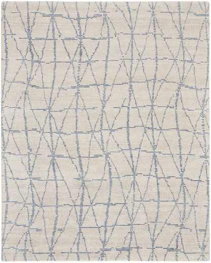 Beige woven rug with light blue embroidered triangular lattice pattern; soft decorative area rug, 8' x 10'.