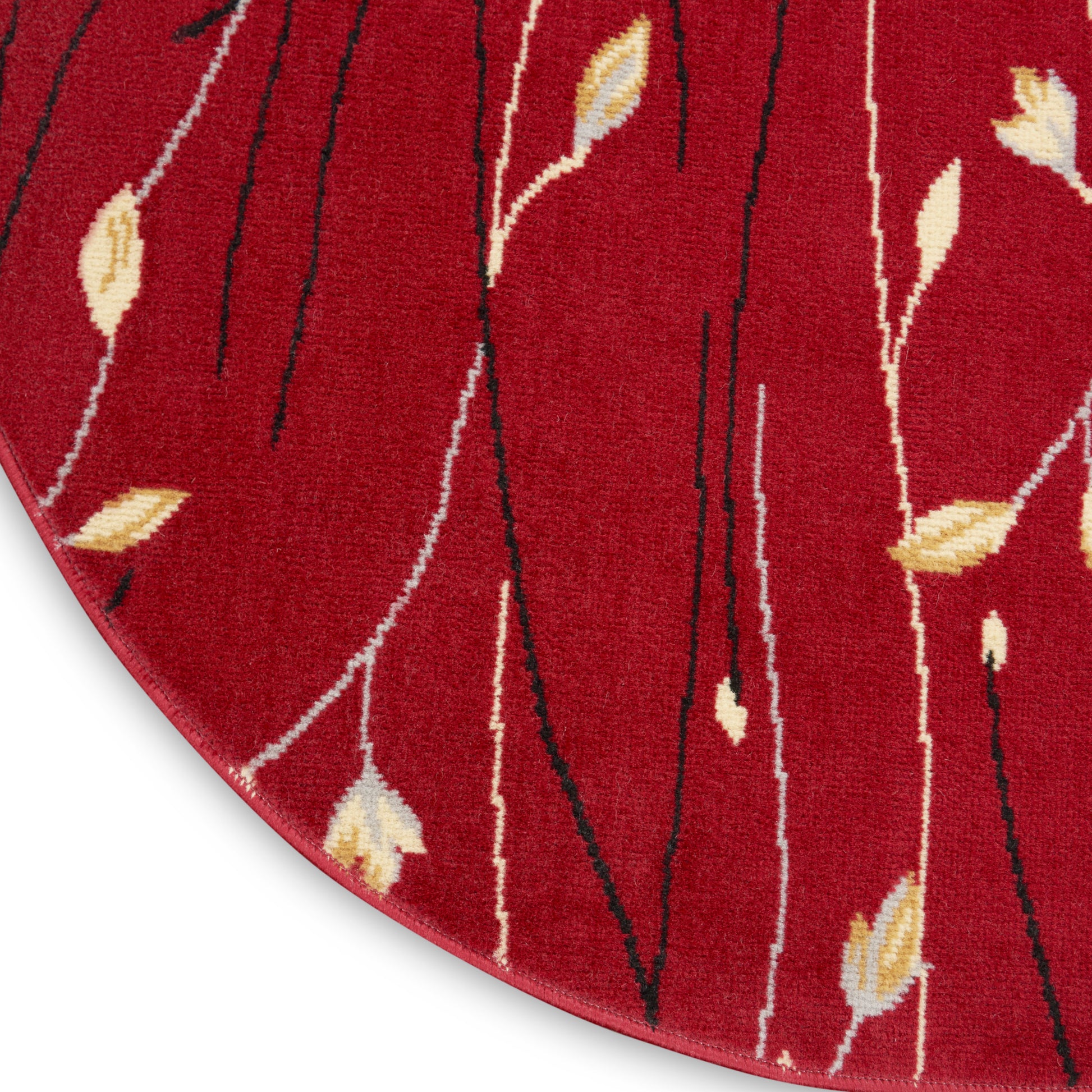 Round red rug with slender black and white stems and yellow leaf accents; wool texture.