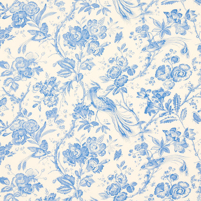 Blue and white toile-style floral pattern with birds on a cream background.