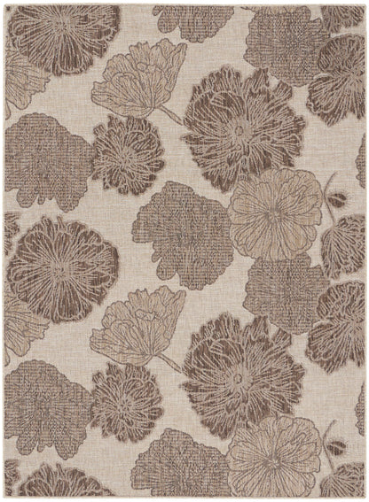 Beige rug with a taupe floral pattern of large circular blossoms connected by vines.