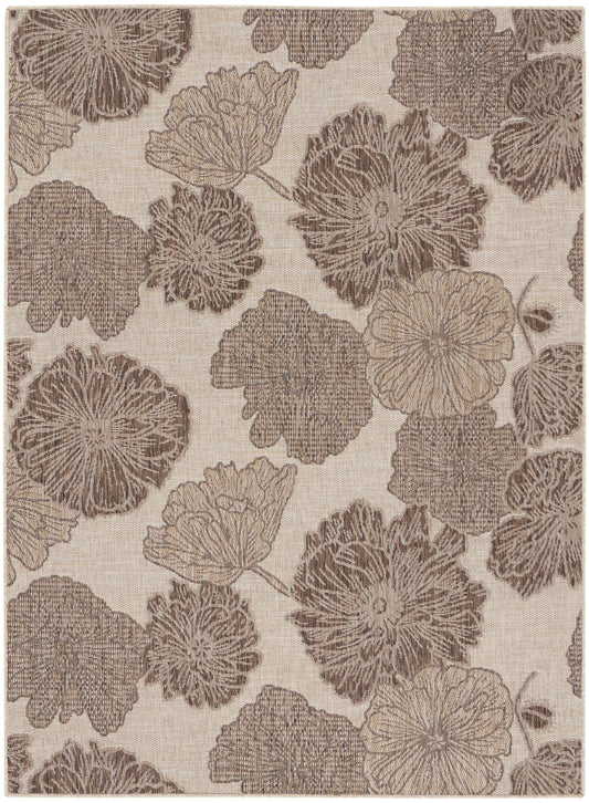 Beige rug with a taupe floral pattern of large circular blossoms connected by vines.