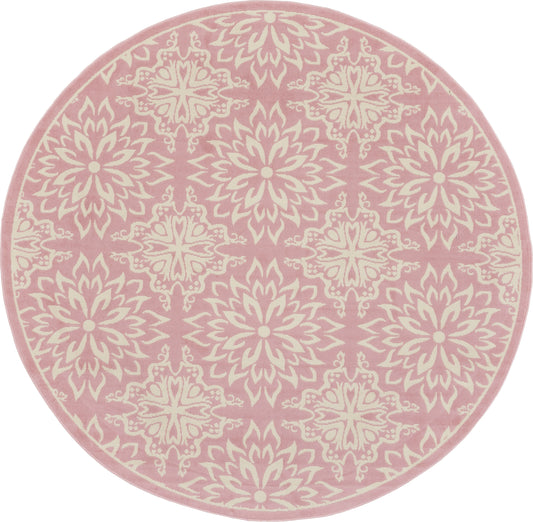 Round pink rug with ivory ornate medallion motifs; plush textile for living room or bedroom.