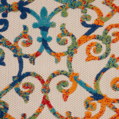 Beige mesh fabric with multicolor embroidery of swirling scrolls in blue, teal, orange, green and red.