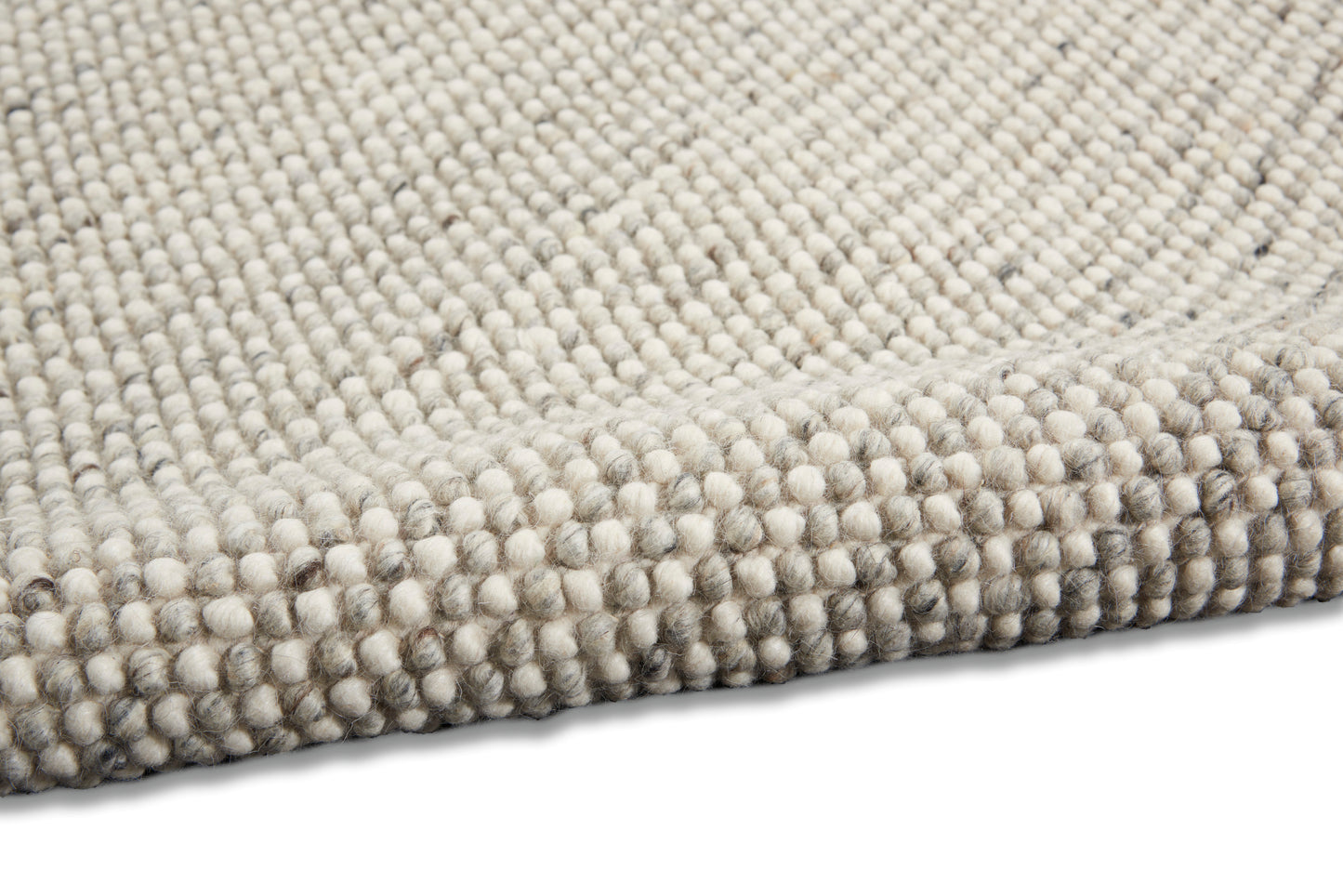Beige & gray boucle rug, close-up showing dense loop-pile texture and soft wool-like fibers.