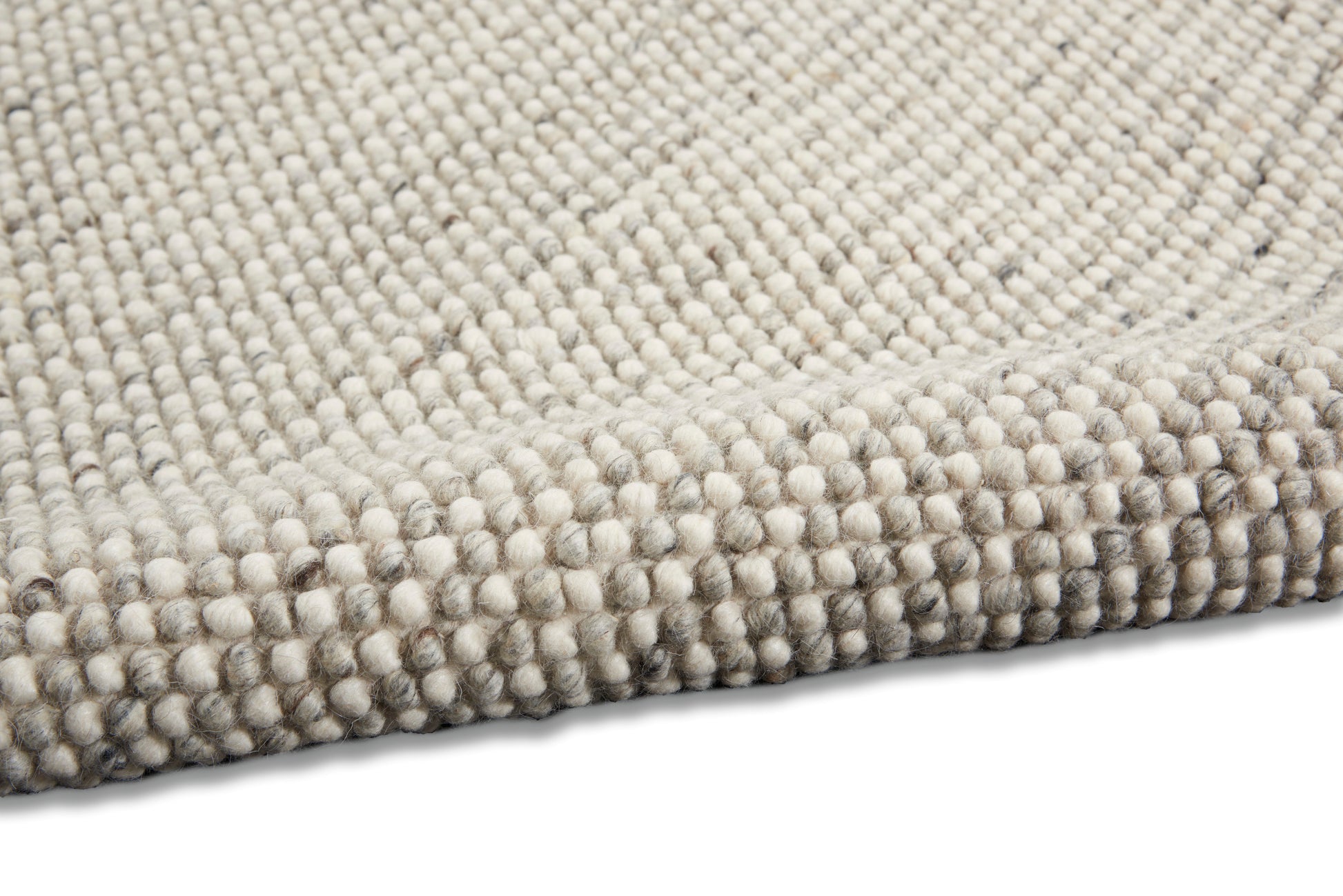 Beige & gray boucle rug, close-up showing dense loop-pile texture and soft wool-like fibers.