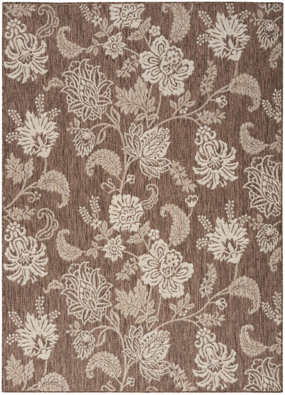 Brown rectangular rug with cream pattern and woven texture; decorative area rug.