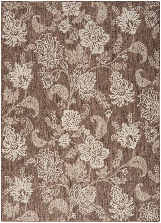 Brown rectangular rug with cream pattern and woven texture; decorative area rug.