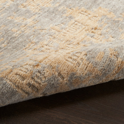Close-up of a gray and tan textured rug with a plush pile and subtle geometric pattern, modern 8' x 10' rug.