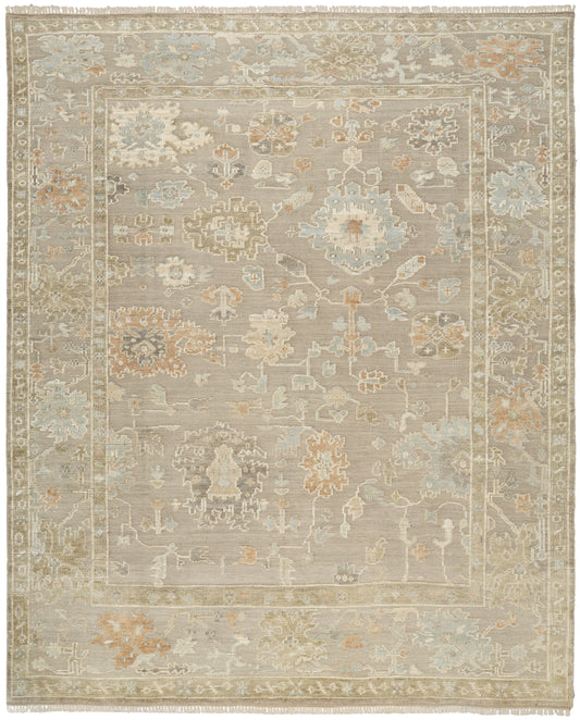 Rectangular vintage-style rug with muted beige, ivory, pale blue and taupe floral motifs in an oriental pattern.