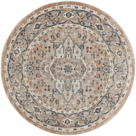 Round beige and blue ornate oriental-style rug with floral medallion and border, soft distressed texture.