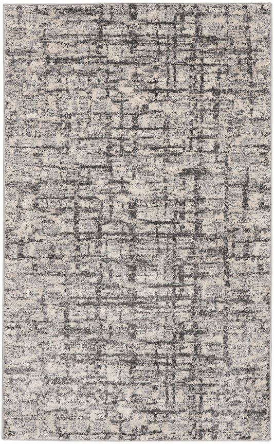 Rectangular area rug with beige & charcoal distressed abstract pattern; soft, low-pile, modern contemporary style.