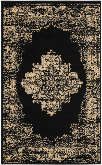 Black area rug featuring a distressed beige Persian-inspired central medallion and ornate border.