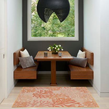 Cozy wooden dining nook with benches, square table, gray walls, peach rug, black pendant lamp, floral centerpiece.