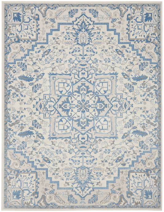 Blue and ivory oriental rug featuring a central floral medallion, intricate arabesques and stepped border.