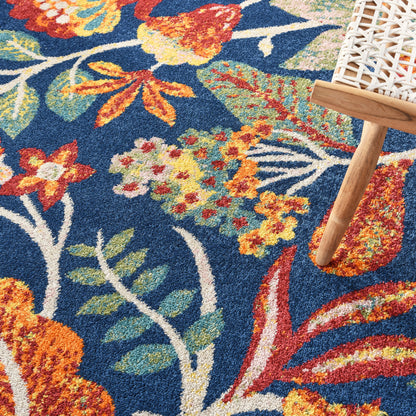 Blue floral area rug with vibrant orange, yellow, and green blossoms; 8' x 10'.