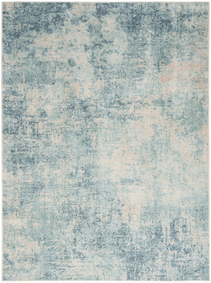 Abstract blue and cream distressed area rug with a soft pile; modern, versatile home decor.