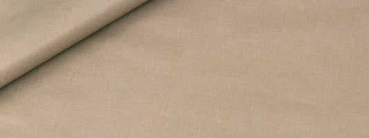 Beige linen-like fabric with a folded corner; smooth, matte textile ideal for upholstery or crafts.