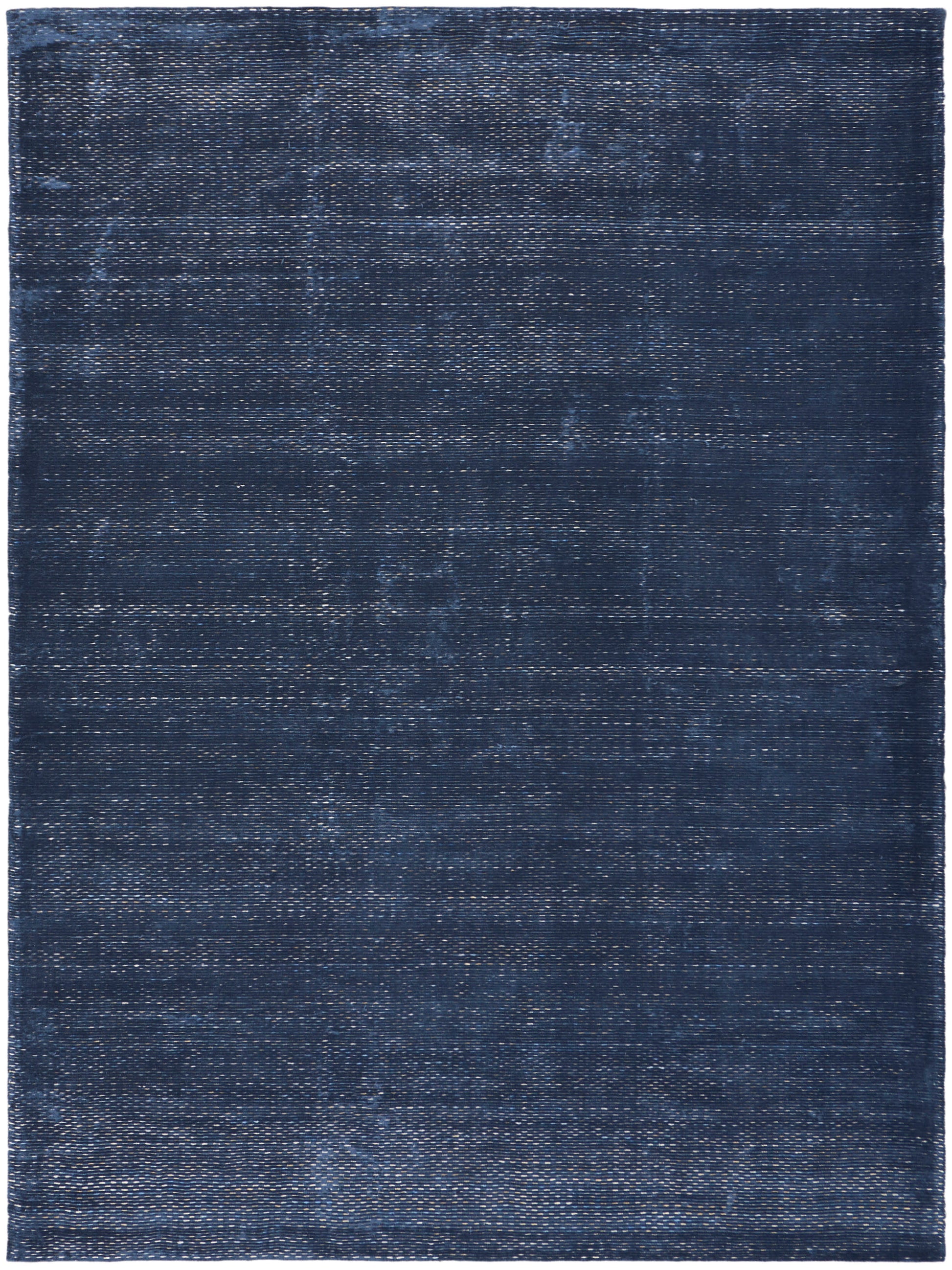 Dark navy rectangular rug with distressed, washed texture and subtle woven pattern.