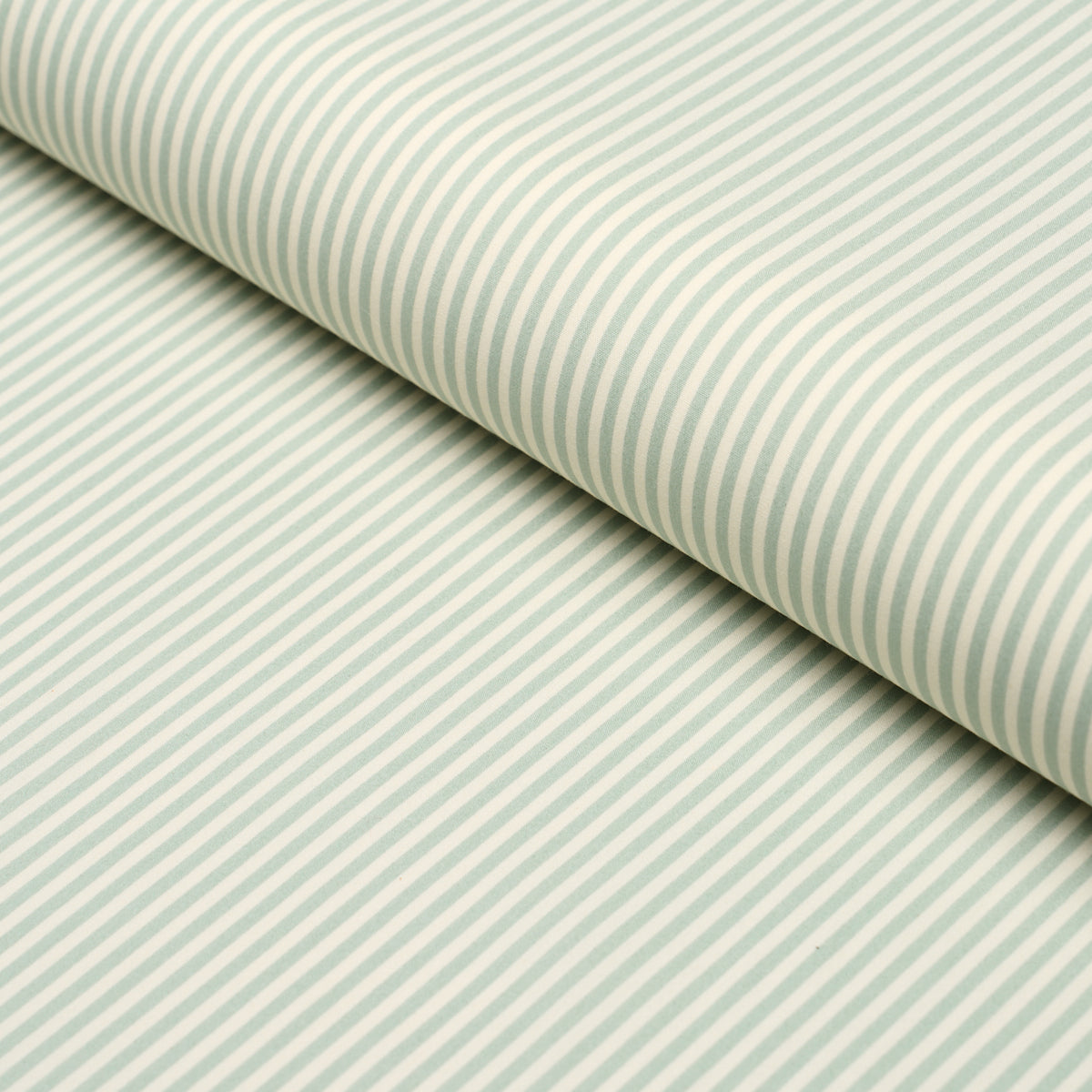 Aqua and white diagonal striped poplin fabric roll, close-up view.