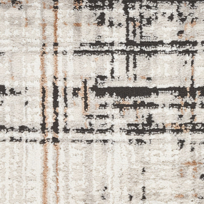 Cream shag rug with black and rust abstract lines, soft high-pile texture and modern pattern.