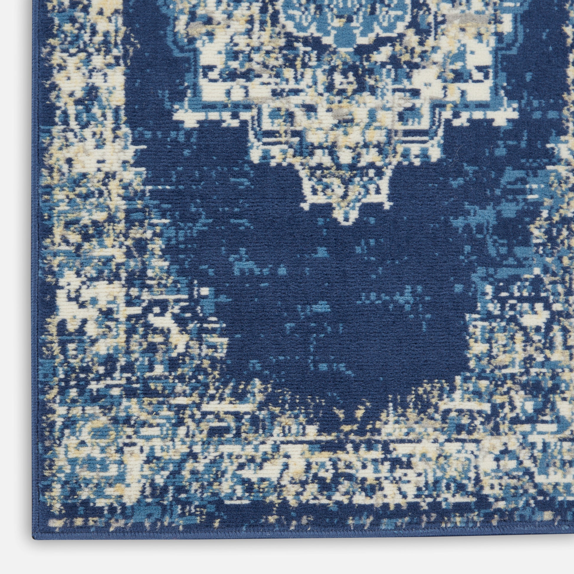 Distressed navy blue oriental runner with cream and light blue faded medallion border; rectangular, vintage style, 12' long.