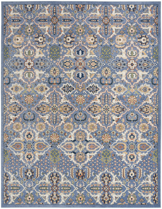 Blue oriental rug with intricate cream, beige and green floral medallion pattern and decorative border.