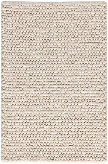 Beige rectangular plush rug with tiny bubble-like tufted texture, soft bath or entryway mat.