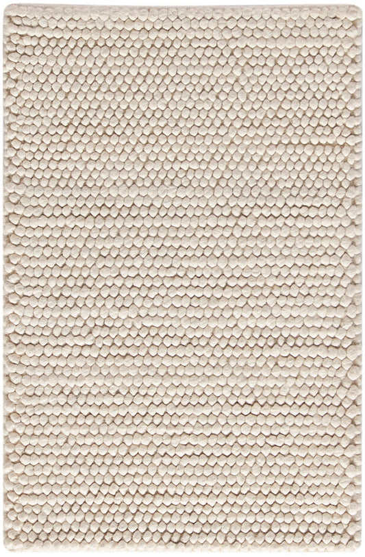 Beige rectangular plush rug with tiny bubble-like tufted texture, soft bath or entryway mat.