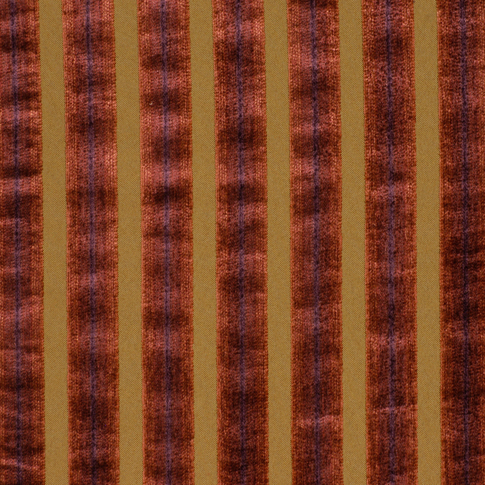 Rust-orange & tan vertical striped velvet fabric with textured, alternating wide & narrow bands.