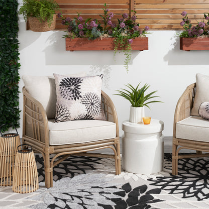 Leaf-patterned tropical rug in black and white.
