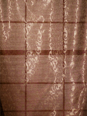 Brown plaid drapery fabric with subtle horizontal stripes and cream scrolling embroidery.