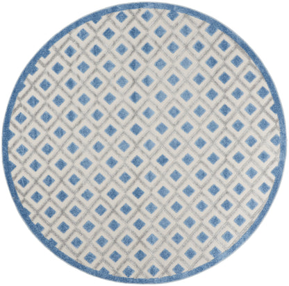 Round rug with light gray background and blue diamond lattice pattern, blue border.