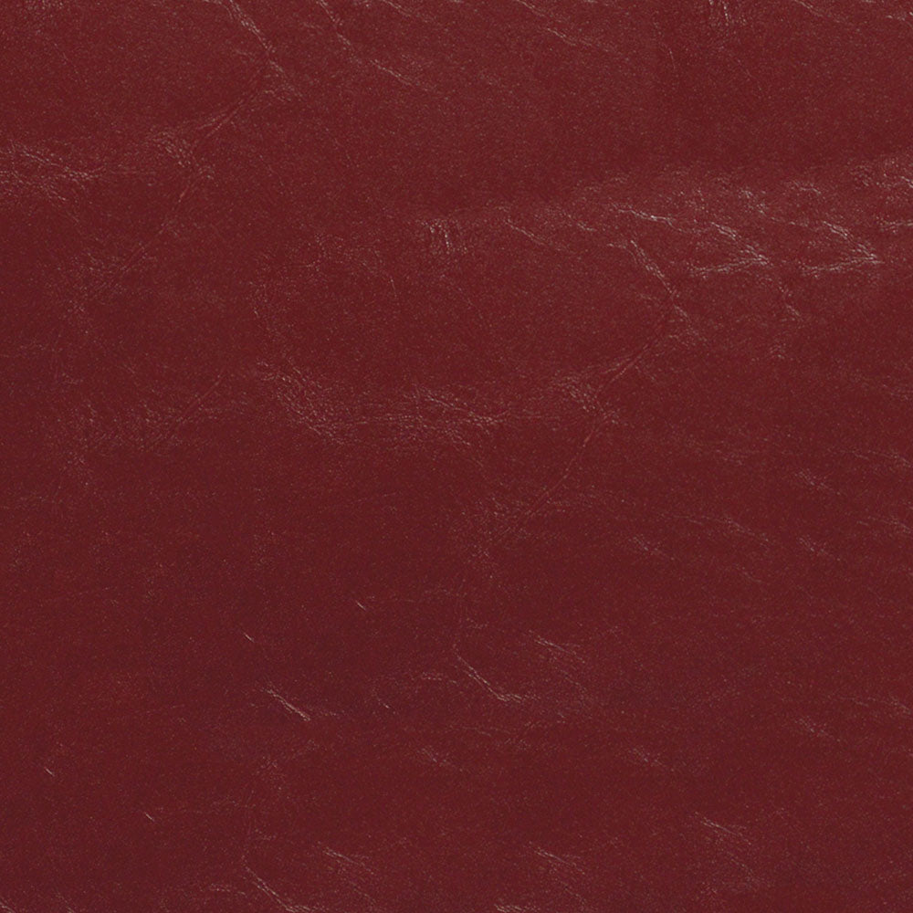 Dark red leather texture with visible grain and subtle scuffs.