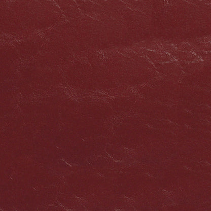 Dark red leather texture with visible grain and subtle scuffs.