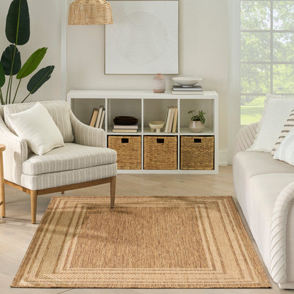 Neutral living room with white cubby storage, woven baskets, beige braided rug, striped armchair, white sofa, plant and wicker pendant light