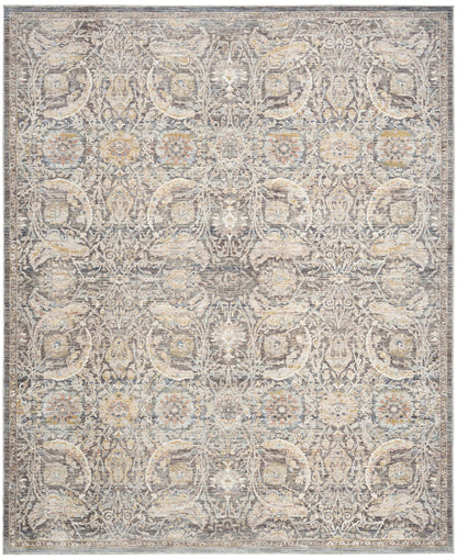 Rectangular vintage-style oriental rug in distressed beige-gray with intricate floral damask pattern and blue-tan accents