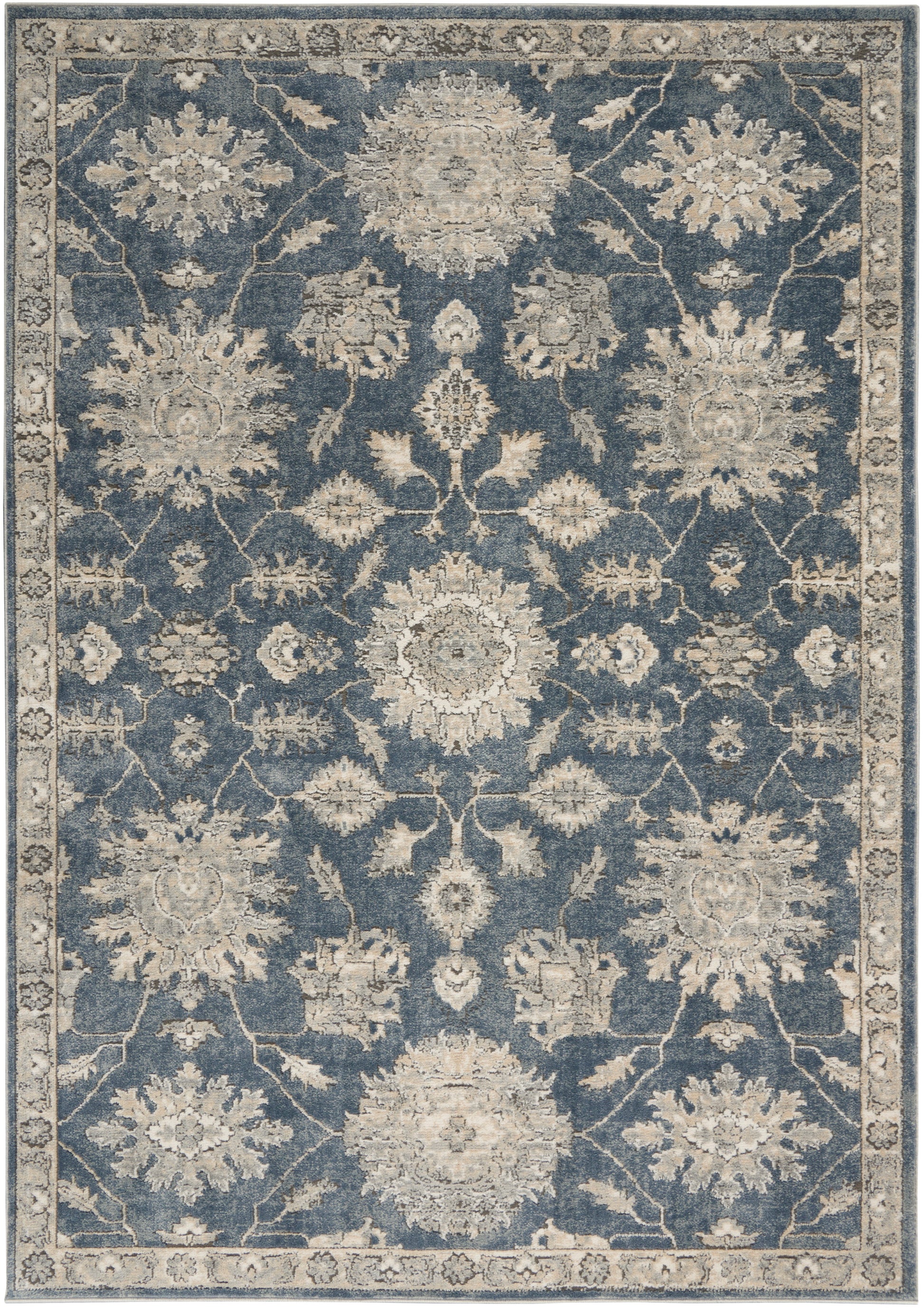 Rectangular blue Persian-style rug with ivory floral medallions, scrolling vines, and a light border.