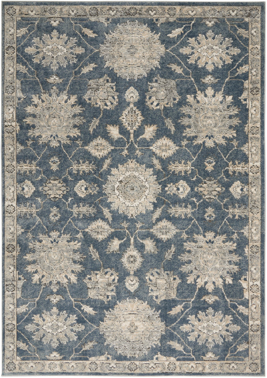 Rectangular blue Persian-style rug with ivory floral medallions, scrolling vines, and a light border.