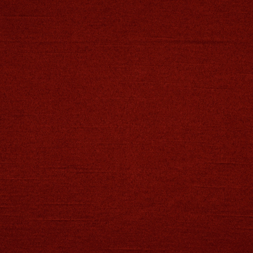 Dark burgundy fabric close-up with subtle weave texture.