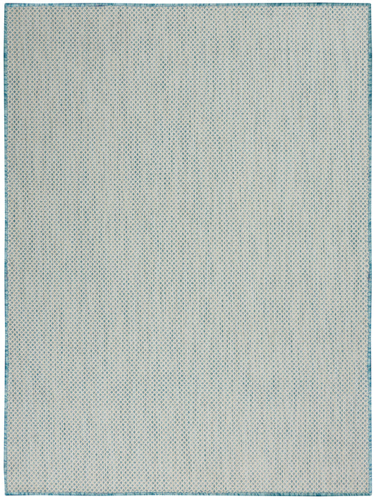 Rectangular woven area rug with cream base, blue dotted lattice pattern and teal border.