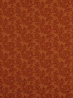 Burnt orange damask floral pattern upholstery fabric with a repeating ornate motif.