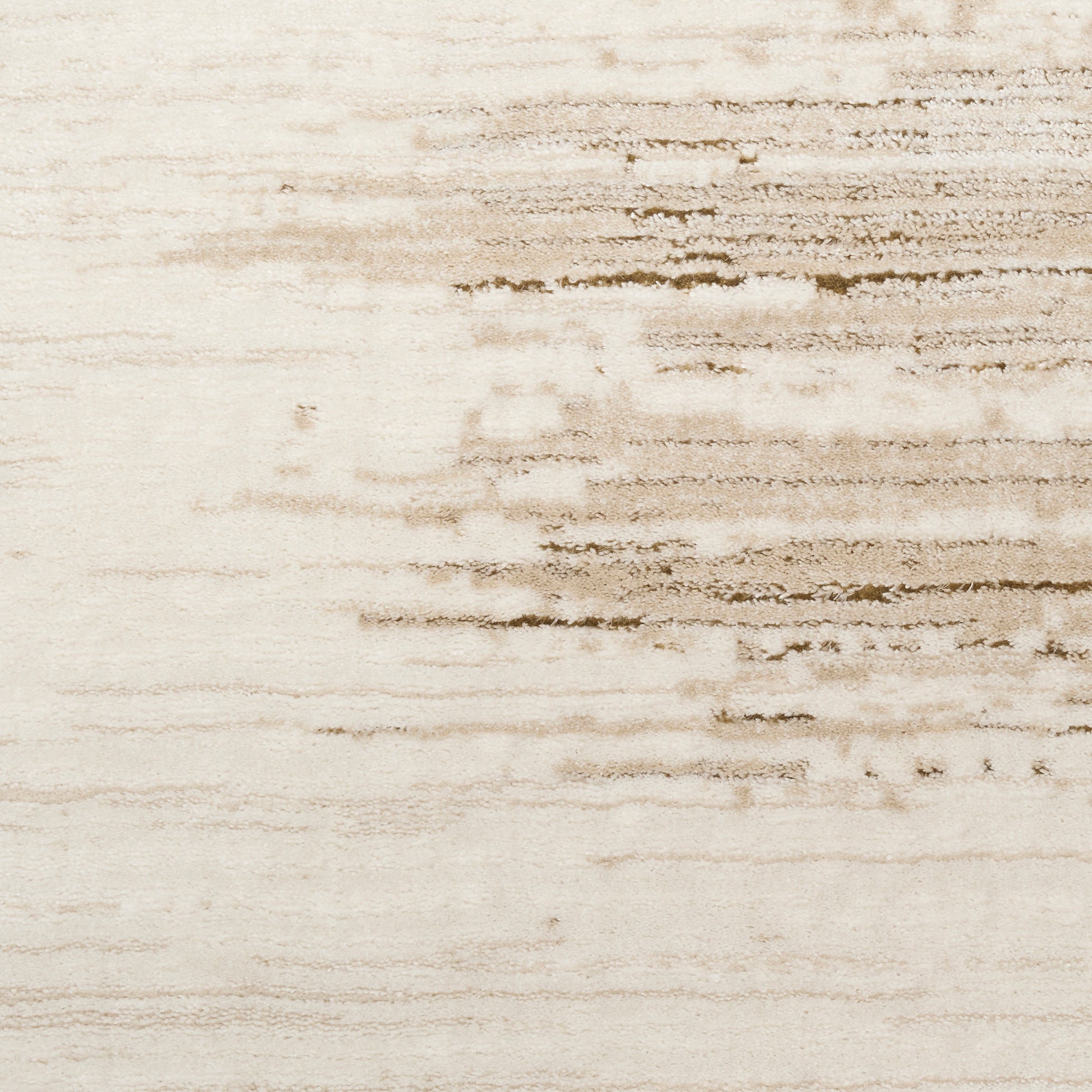 Cream-colored rug with subtle brown streaks and a soft, textured pile; 9' x 12'.