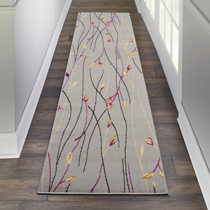 Long hallway runner rug with abstract black and magenta wavy lines and yellow leaves on light gray background.