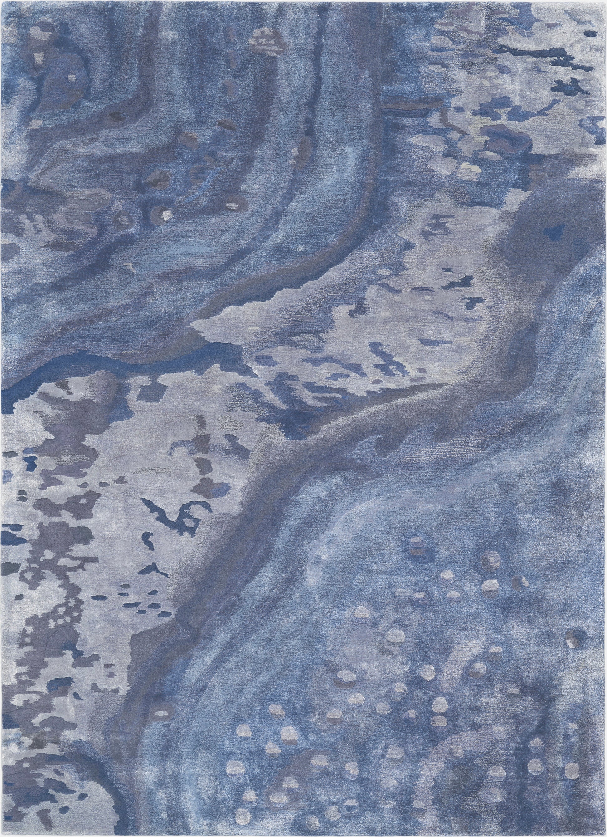 Rectangular blue abstract rug with marbled navy and light blues, soft plush pile and subtle beige speckle accents.