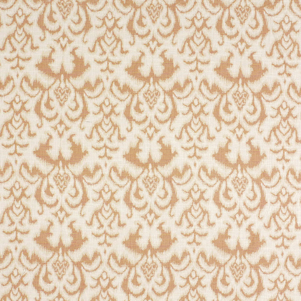 Peach and cream damask patterned fabric texture with ornate scrolling floral motifs, suitable for upholstery.