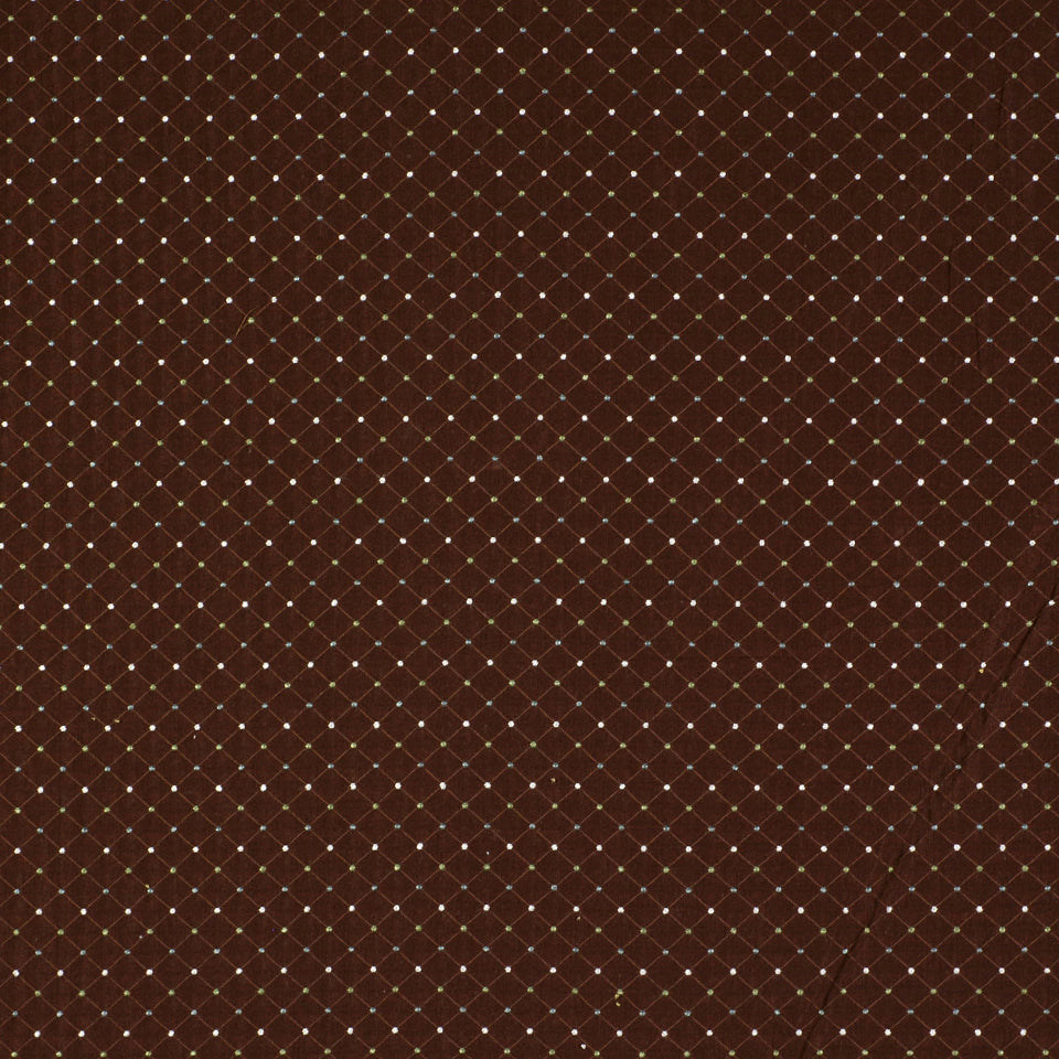 Deep brown fabric with a white dotted diamond lattice pattern, quilted/beaded look.