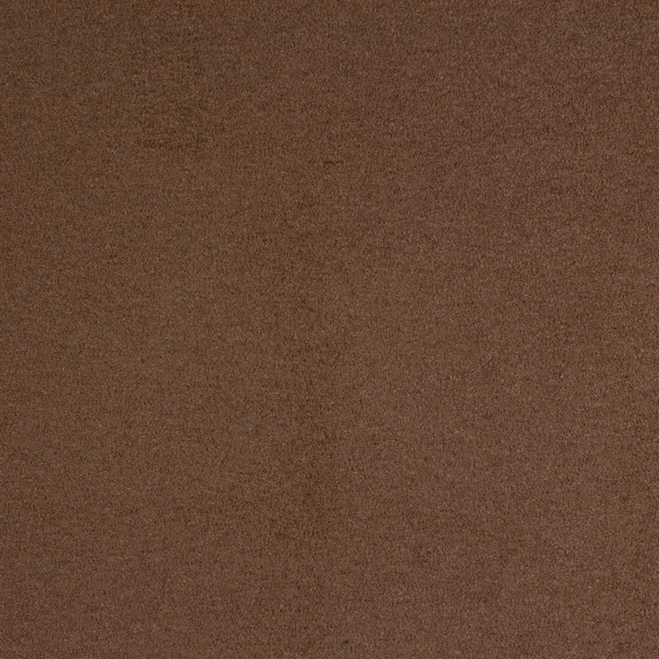 Close-up of brown suede texture with a soft nap.